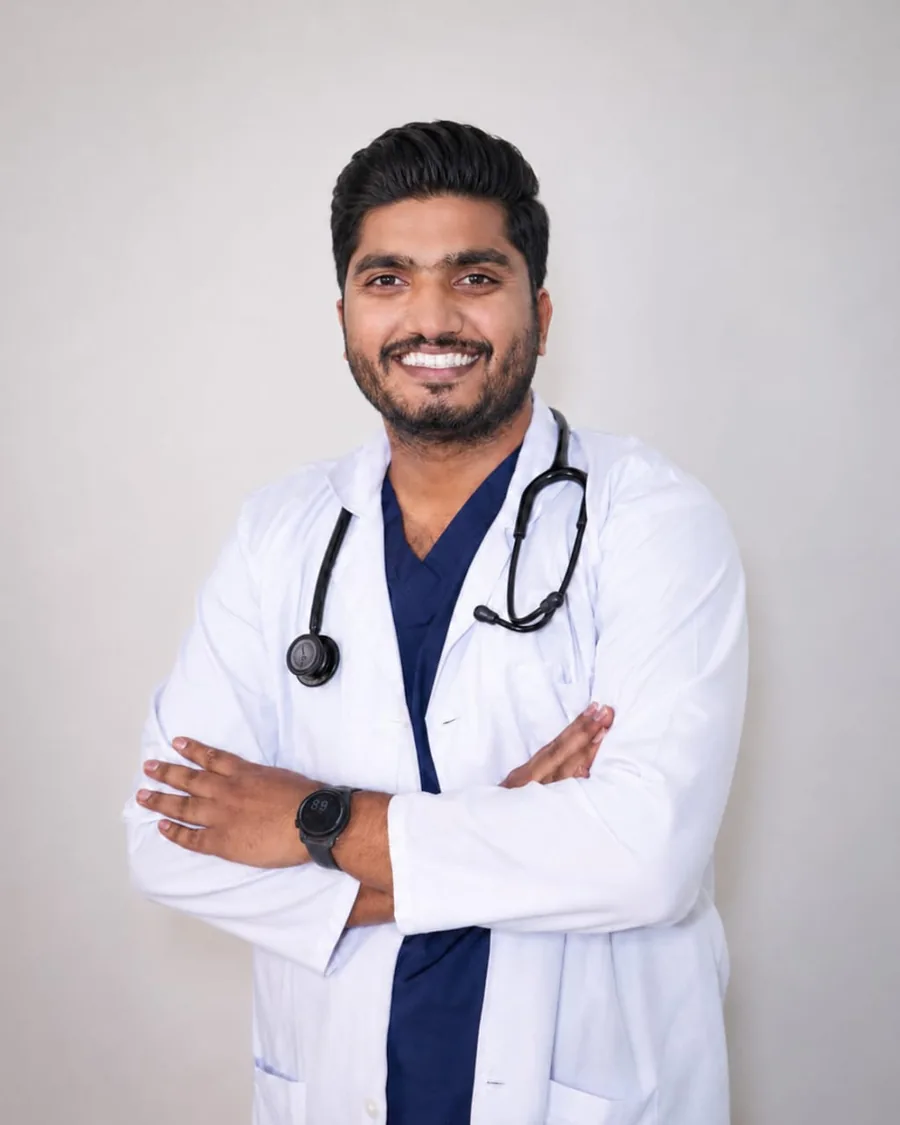 Dr. Akif Ahamad Baig in a white coat with a stethoscope
